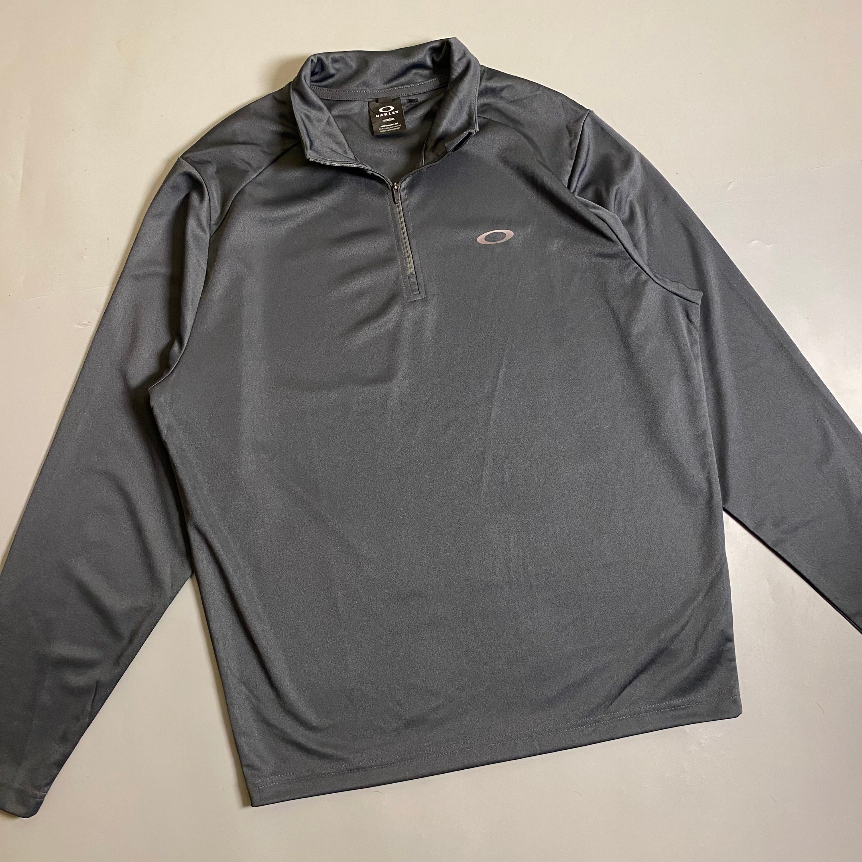 Oakley Foundational 1/4 Zip pullover in a charcoal Colorway