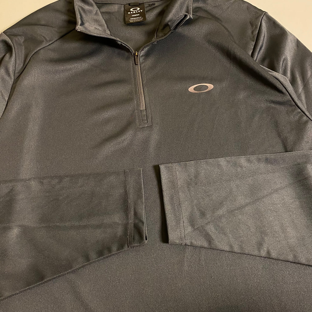 Oakley Foundational 1/4 Zip pullover in a charcoal Colorway
