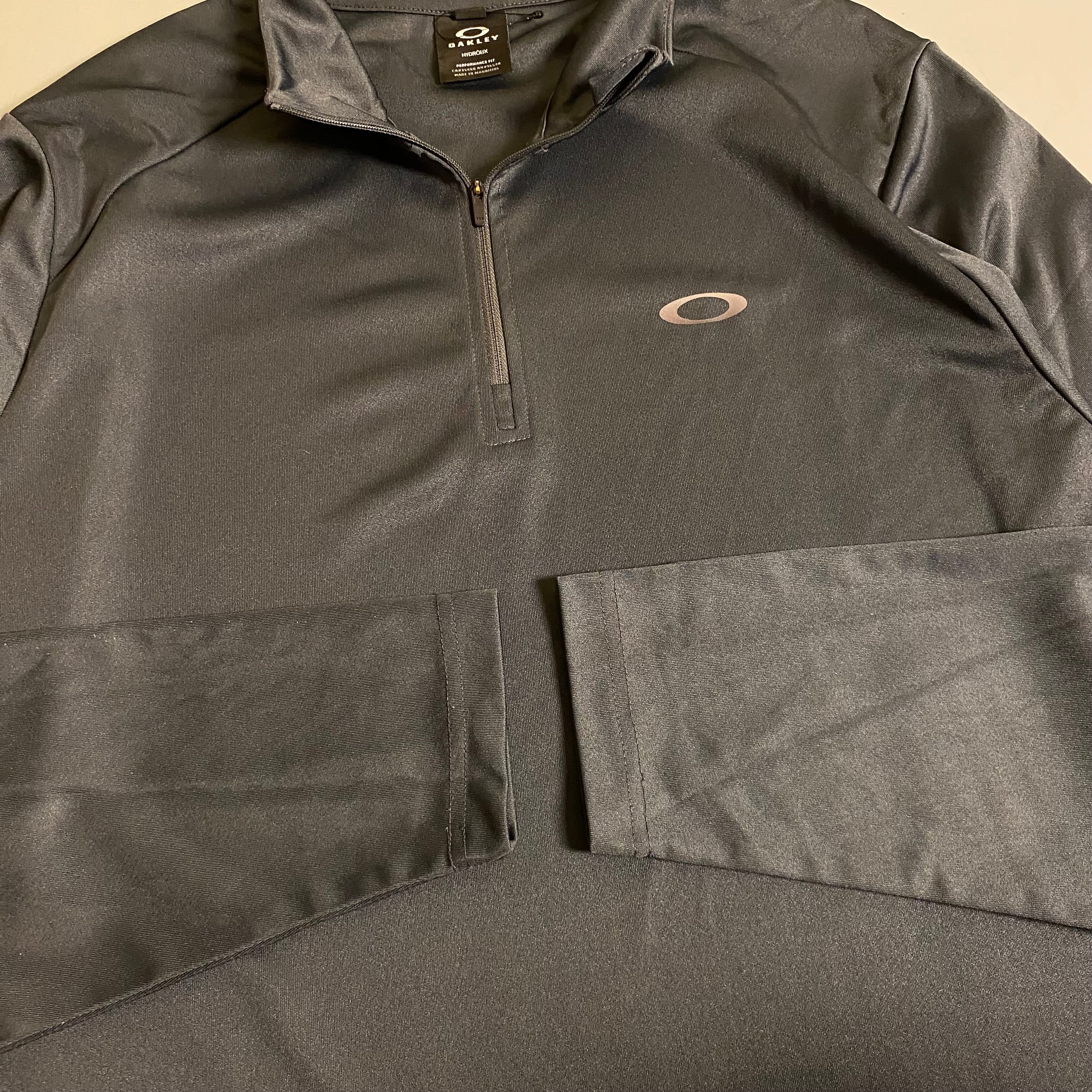Oakley Foundational 1/4 Zip pullover in a charcoal Colorway