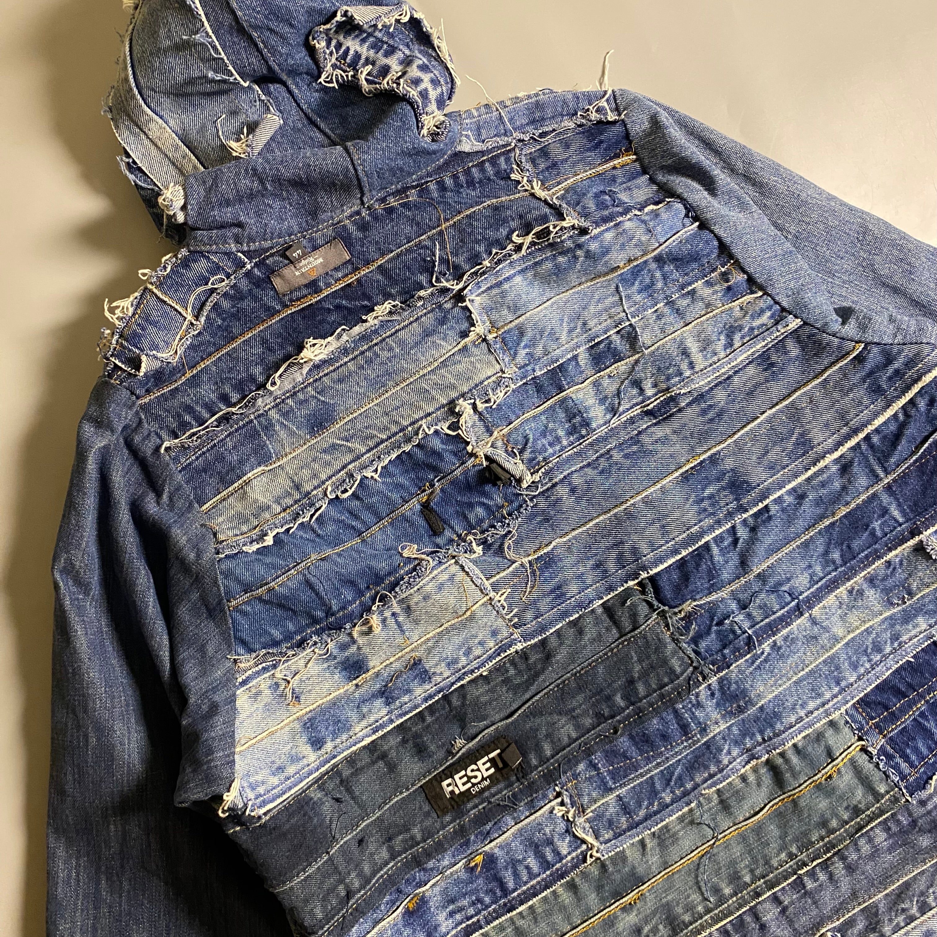 Custom upcycled patchwork denim jacket with a hoodie