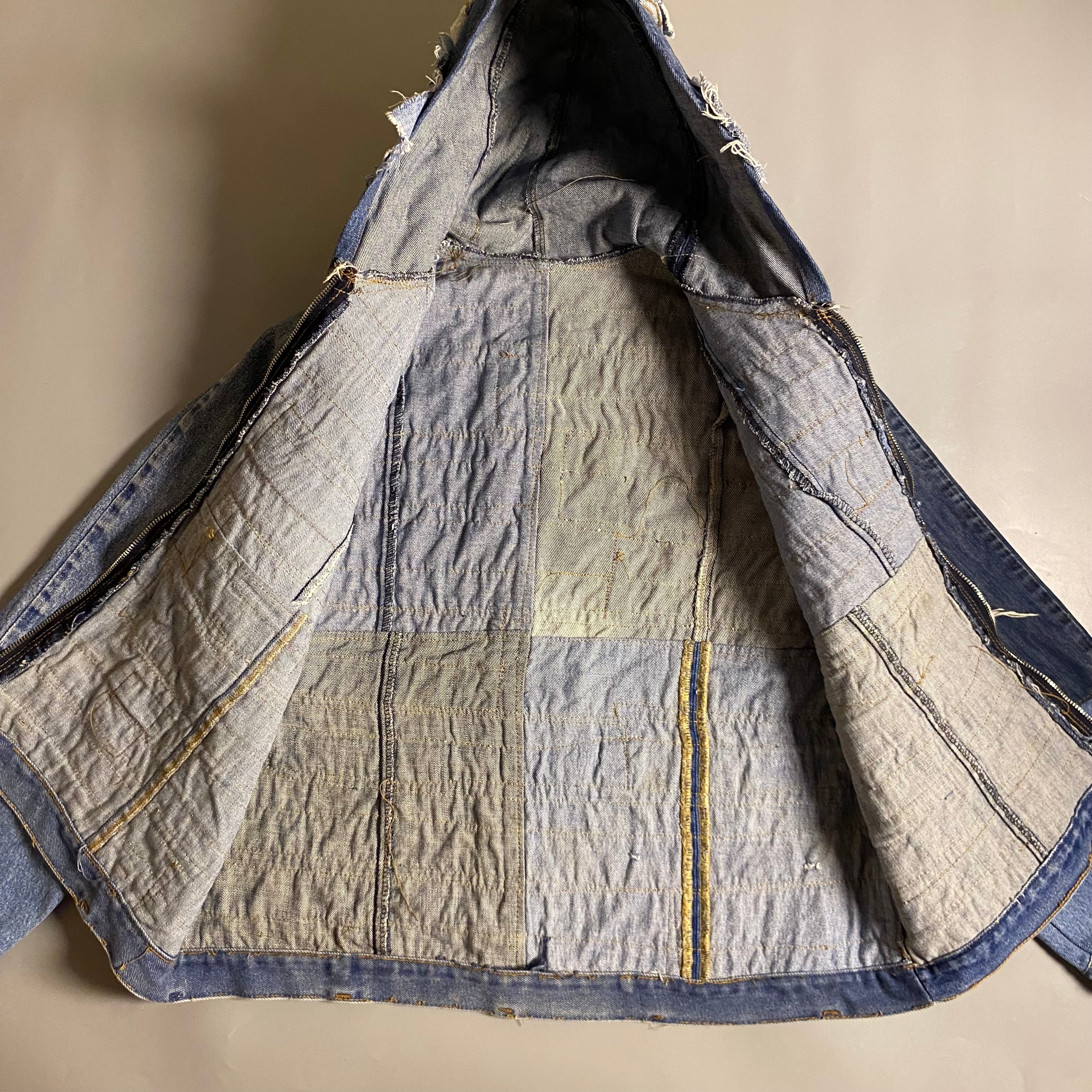 Custom upcycled patchwork denim jacket with a hoodie