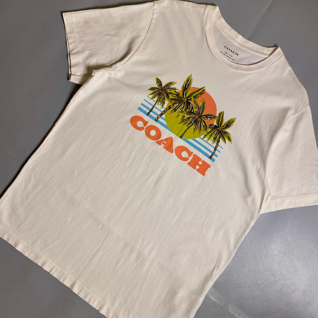 Coach Hawaiian Graphic T-shirt featuring a palm tree and sunset design