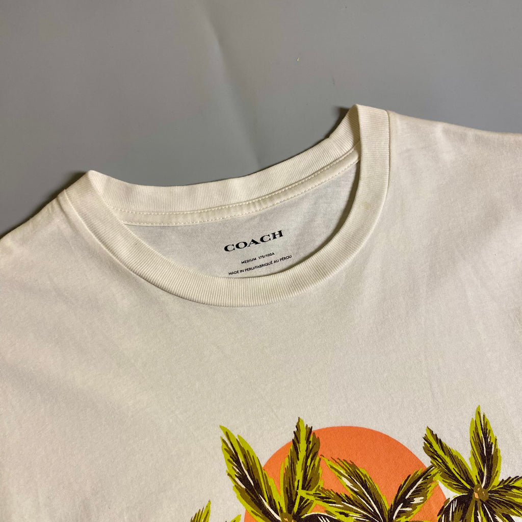 Coach Hawaiian Graphic T-shirt featuring a palm tree and sunset design