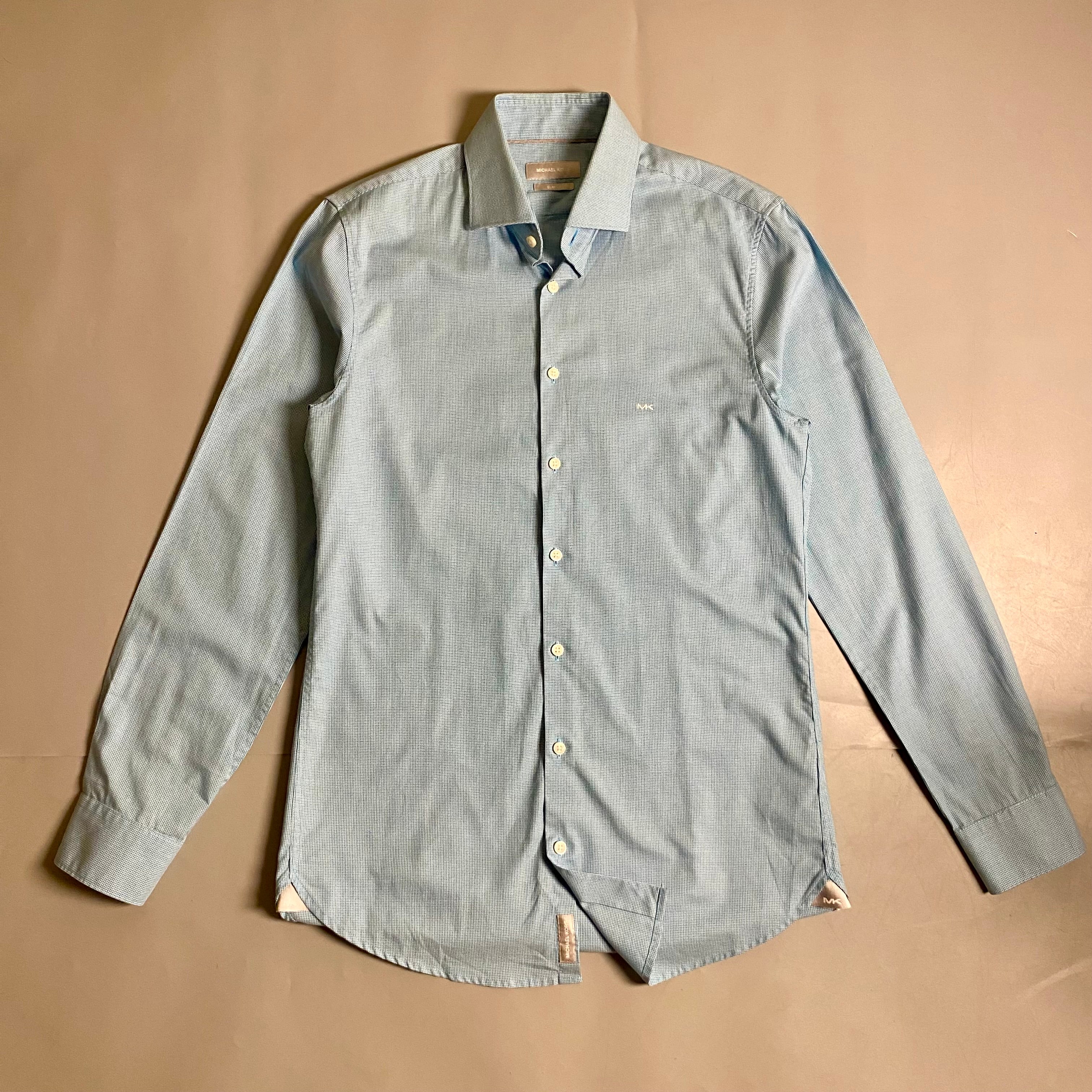 Michael Kors light blue long-sleeve &nbsp;shirt featuring a subtle micro-pattern and embroidered MK logo on the chest