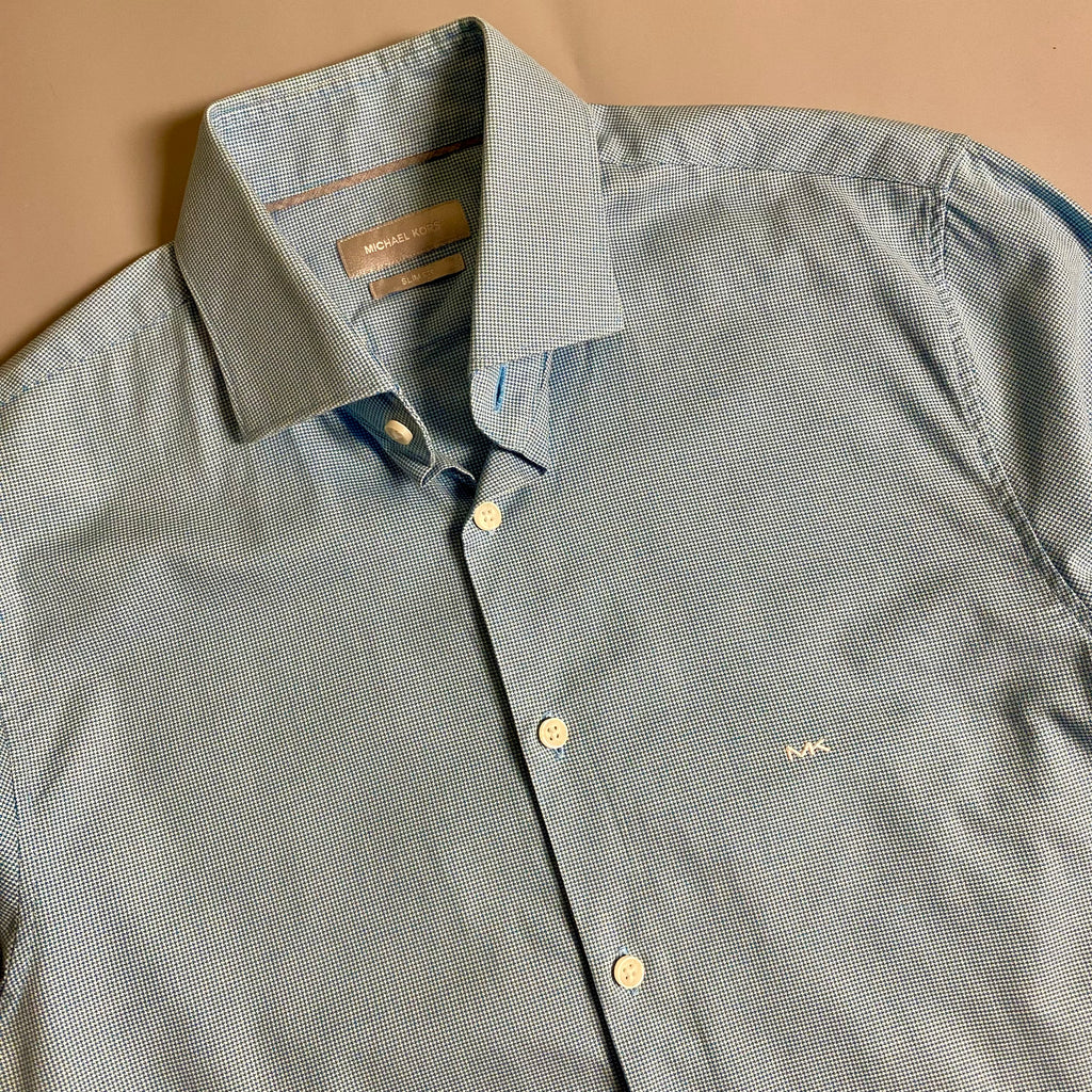 Michael Kors light blue long-sleeve &nbsp;shirt featuring a subtle micro-pattern and embroidered MK logo on the chest