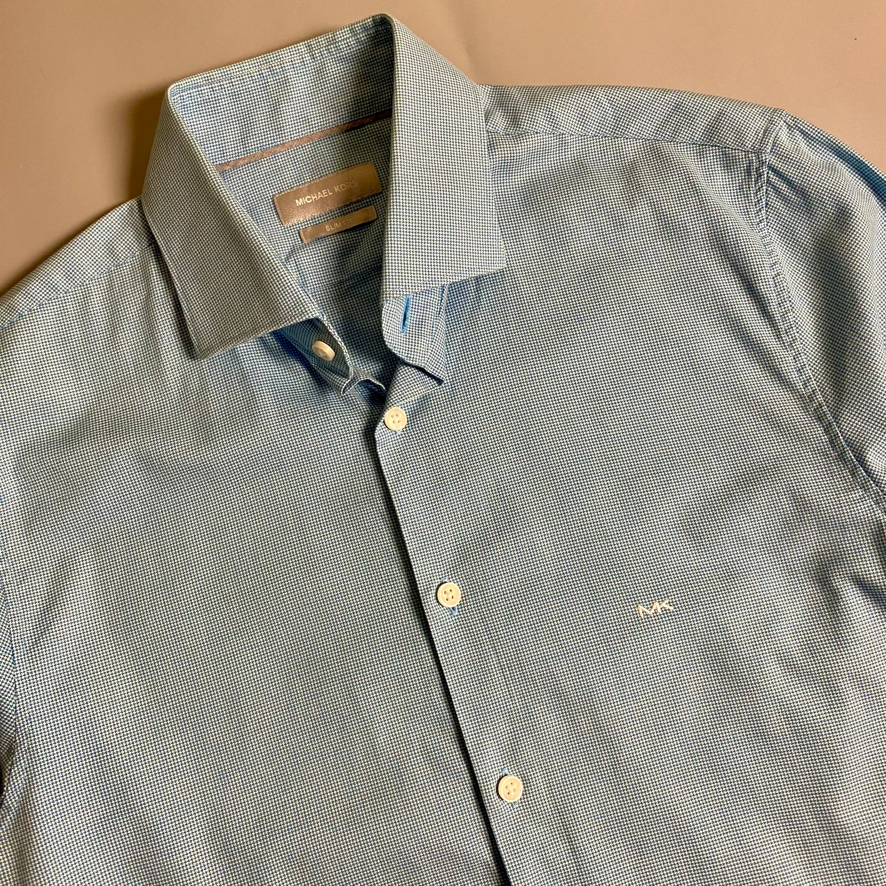 Michael Kors light blue long-sleeve &nbsp;shirt featuring a subtle micro-pattern and embroidered MK logo on the chest