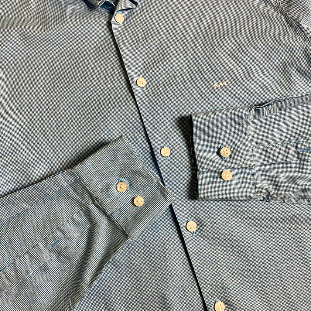 Michael Kors light blue long-sleeve &nbsp;shirt featuring a subtle micro-pattern and embroidered MK logo on the chest