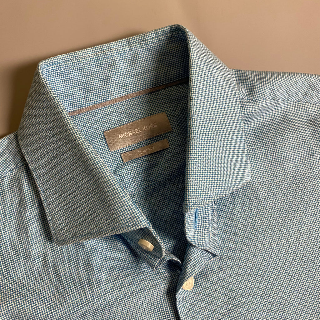 Michael Kors light blue long-sleeve &nbsp;shirt featuring a subtle micro-pattern and embroidered MK logo on the chest