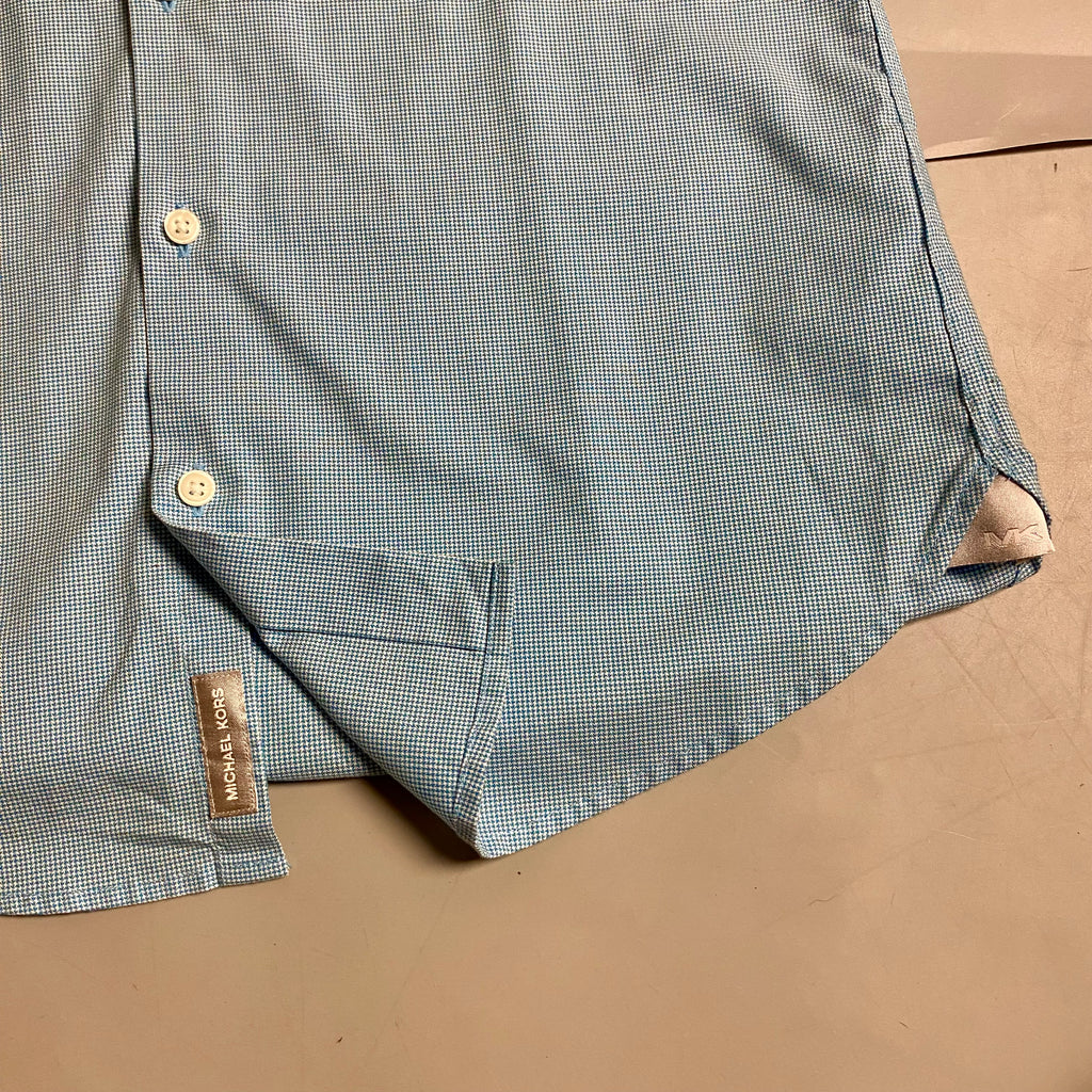 Michael Kors light blue long-sleeve &nbsp;shirt featuring a subtle micro-pattern and embroidered MK logo on the chest