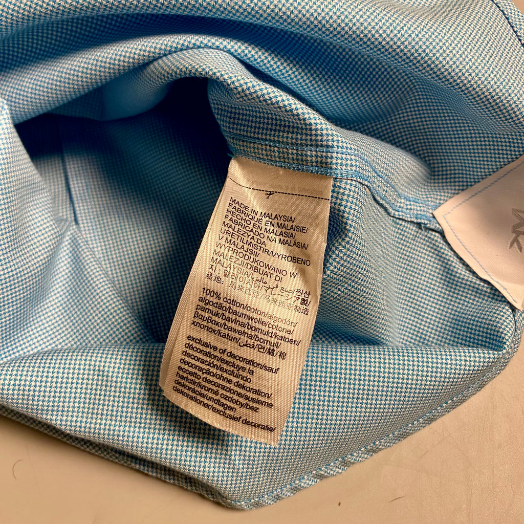 Michael Kors light blue long-sleeve &nbsp;shirt featuring a subtle micro-pattern and embroidered MK logo on the chest