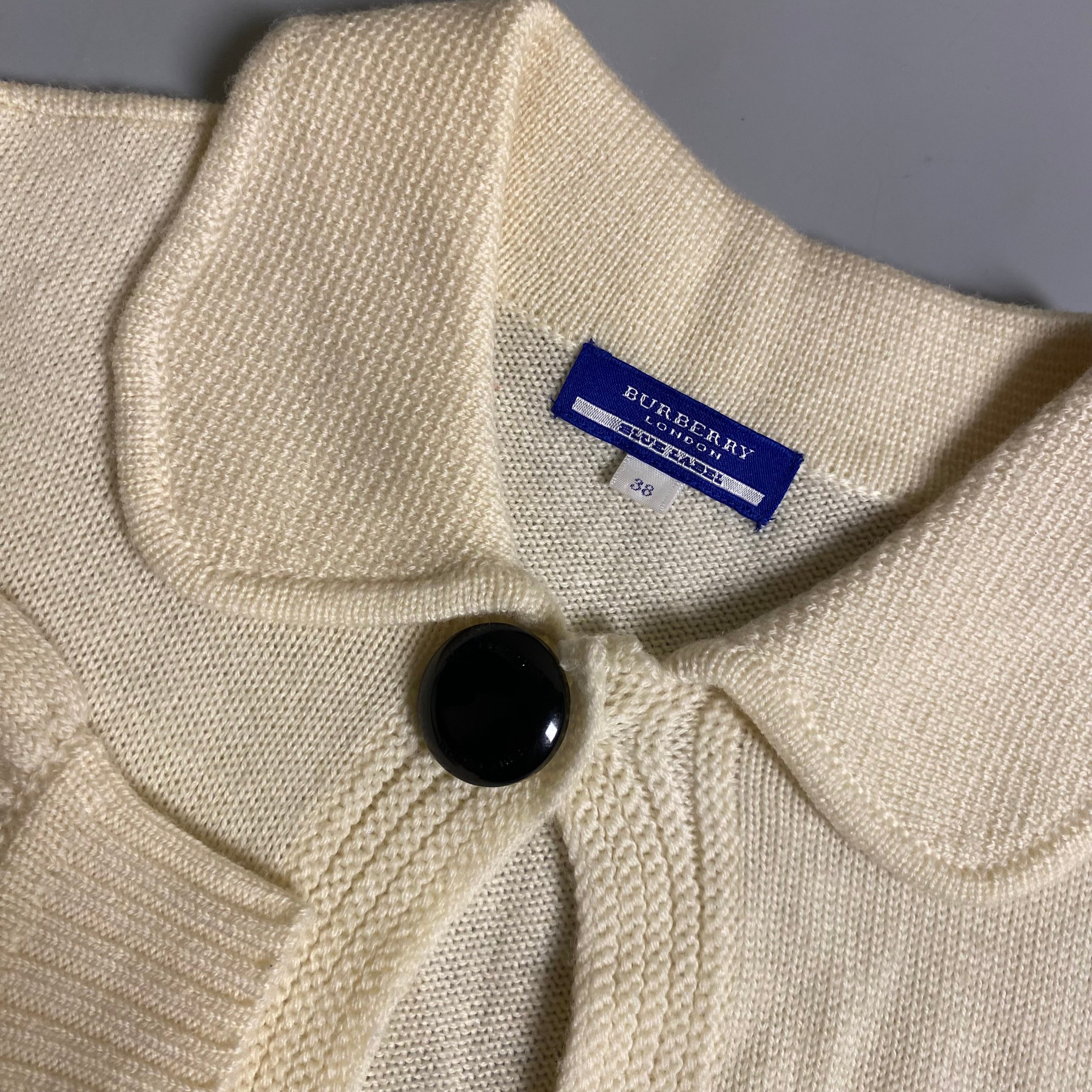 Burberry Blue Label cream knit cropped cardigan with a single button closure