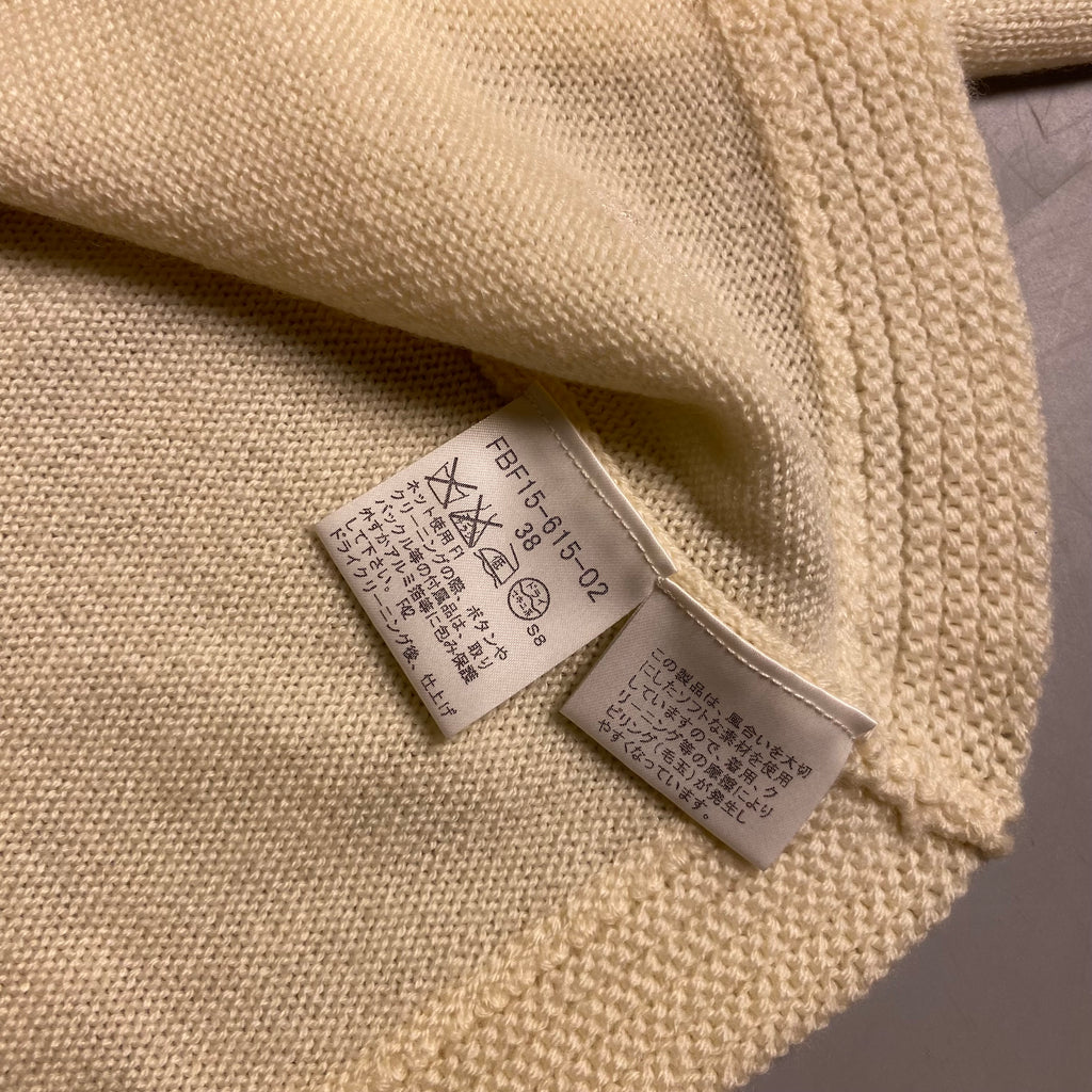 Burberry Blue Label cream knit cropped cardigan with a single button closure