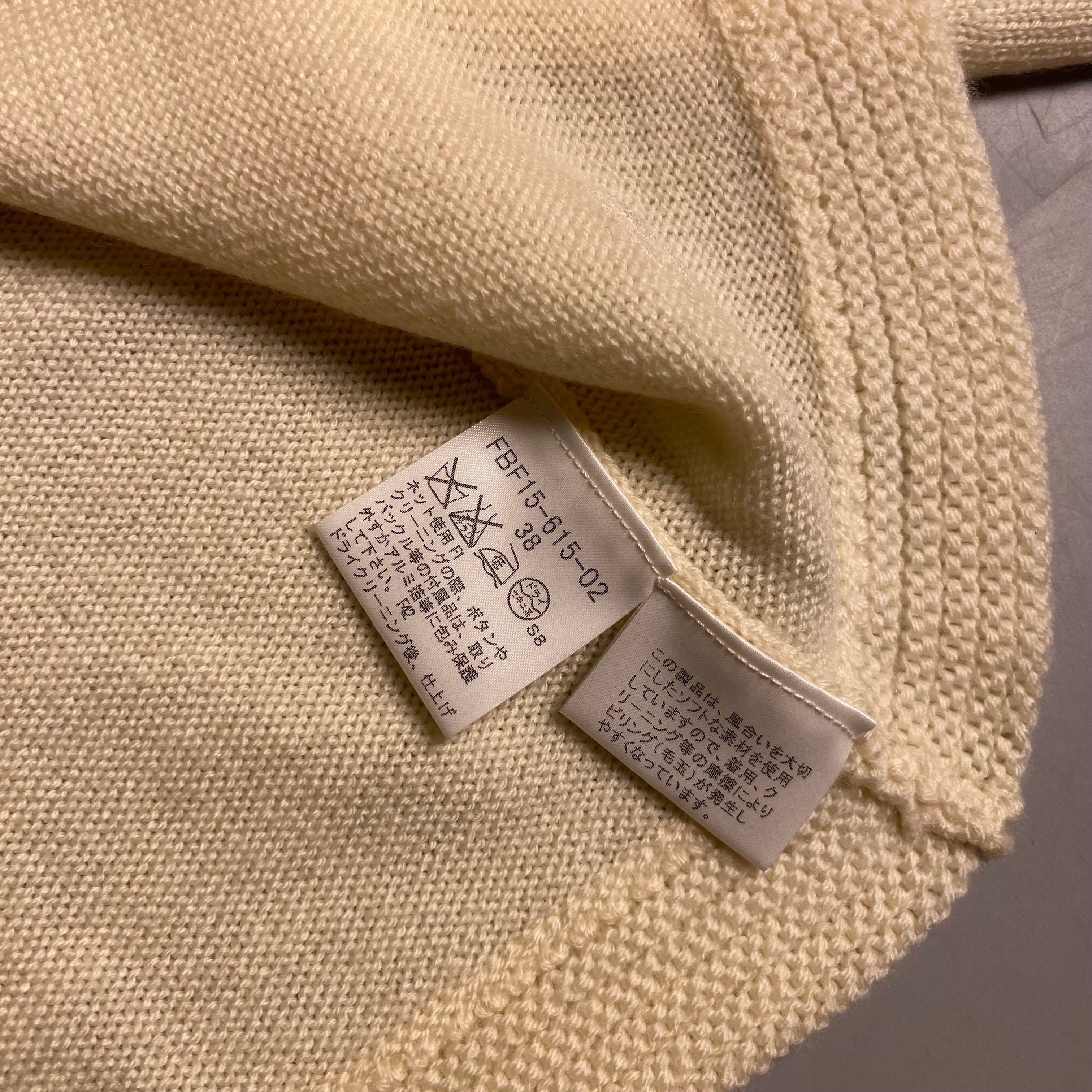 Burberry Blue Label cream knit cropped cardigan with a single button closure