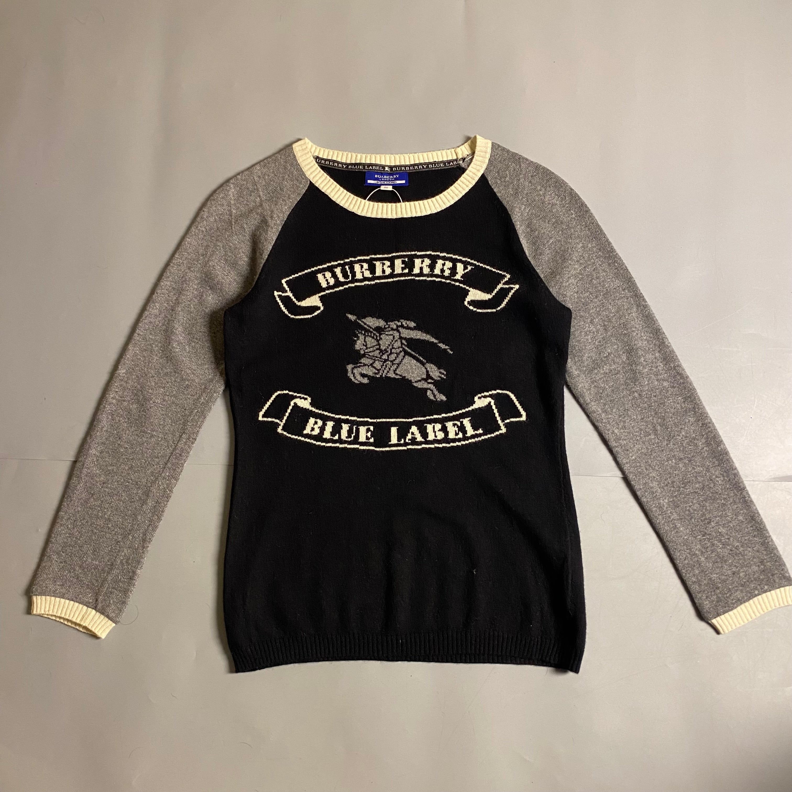 Burberry Blue Label cashmere blend knit sweater featuring an embroidered equestrian knight motif