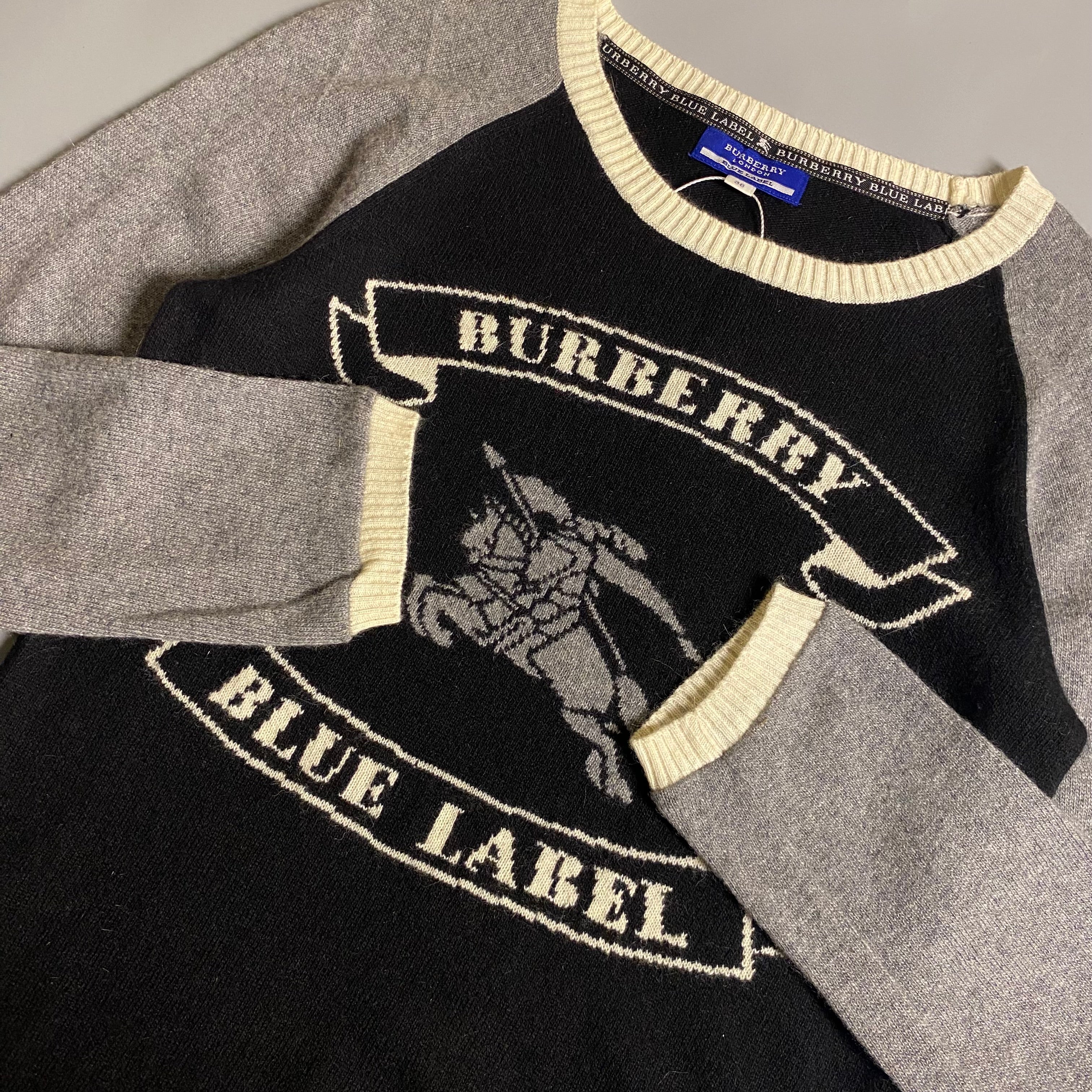 Burberry Blue Label cashmere blend knit sweater featuring an embroidered equestrian knight motif
