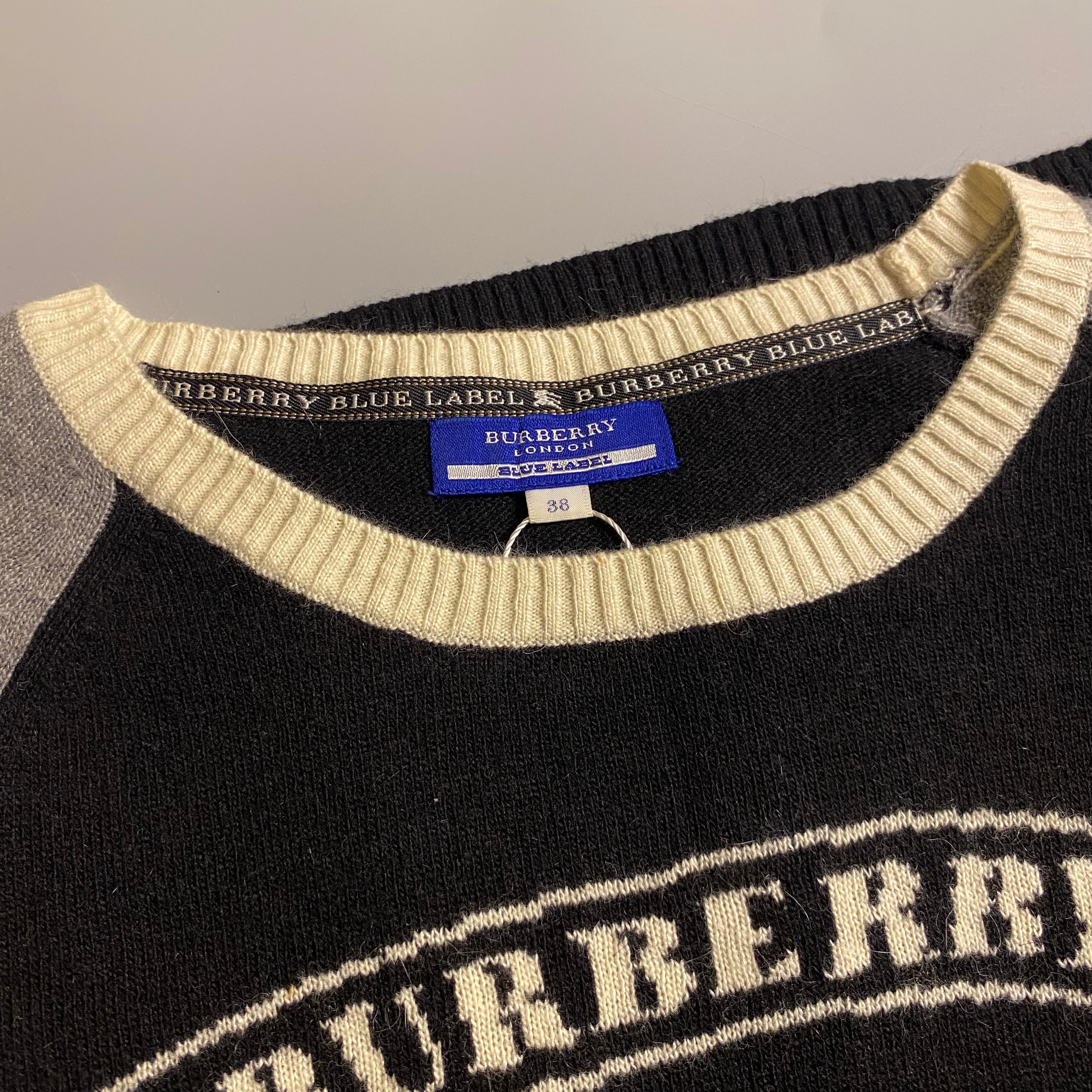Burberry Blue Label cashmere blend knit sweater featuring an embroidered equestrian knight motif