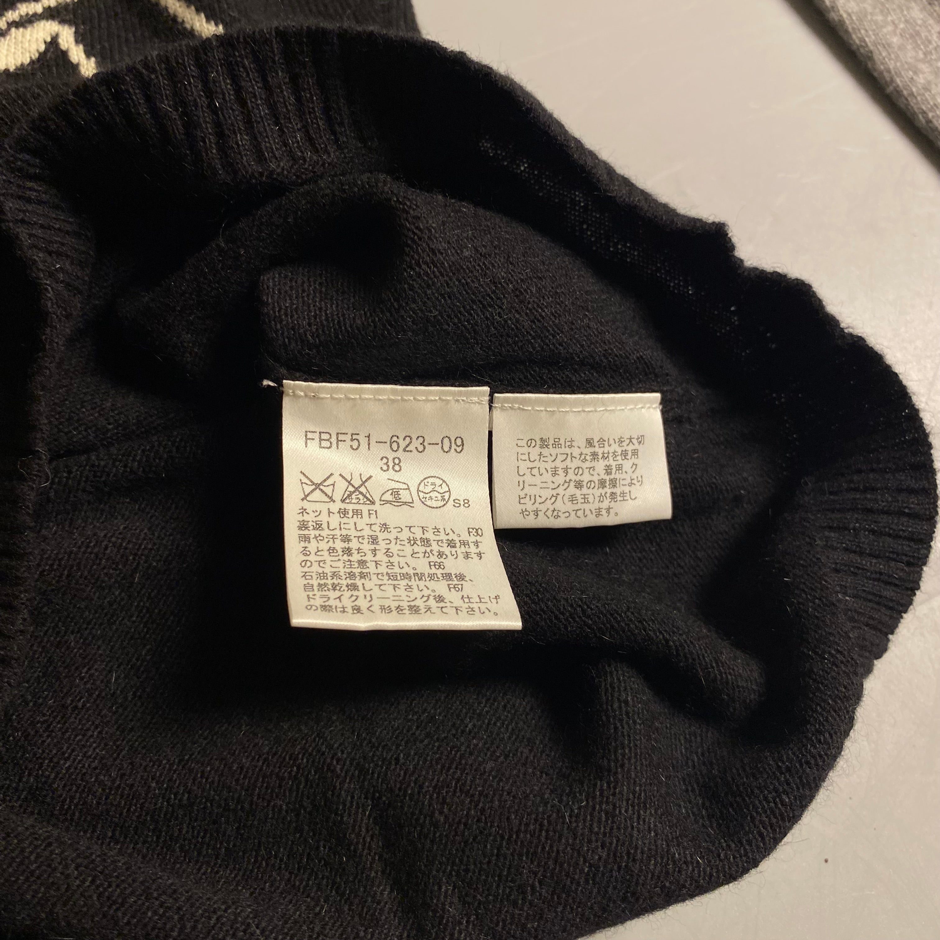 Burberry Blue Label cashmere blend knit sweater featuring an embroidered equestrian knight motif