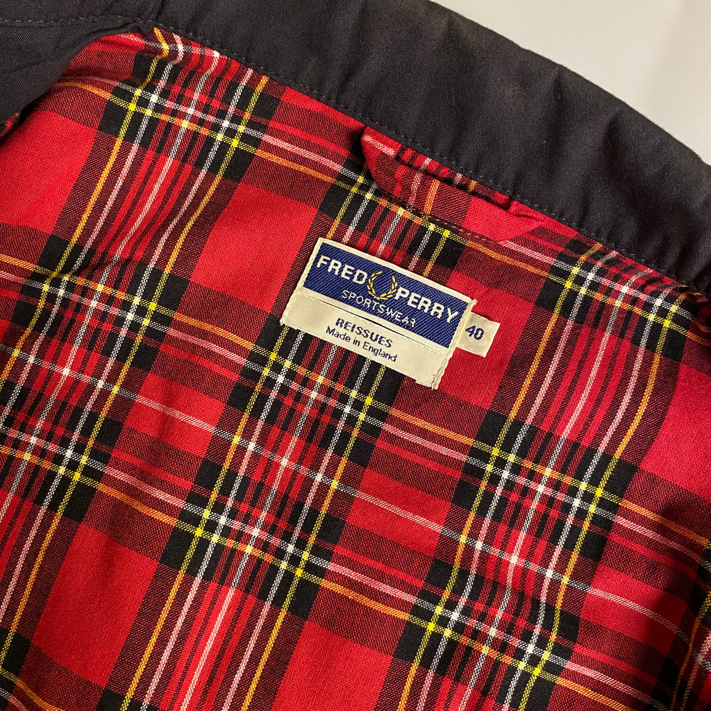 Fred Perry Made In England Harrington Jacket in black with a red tartan lining