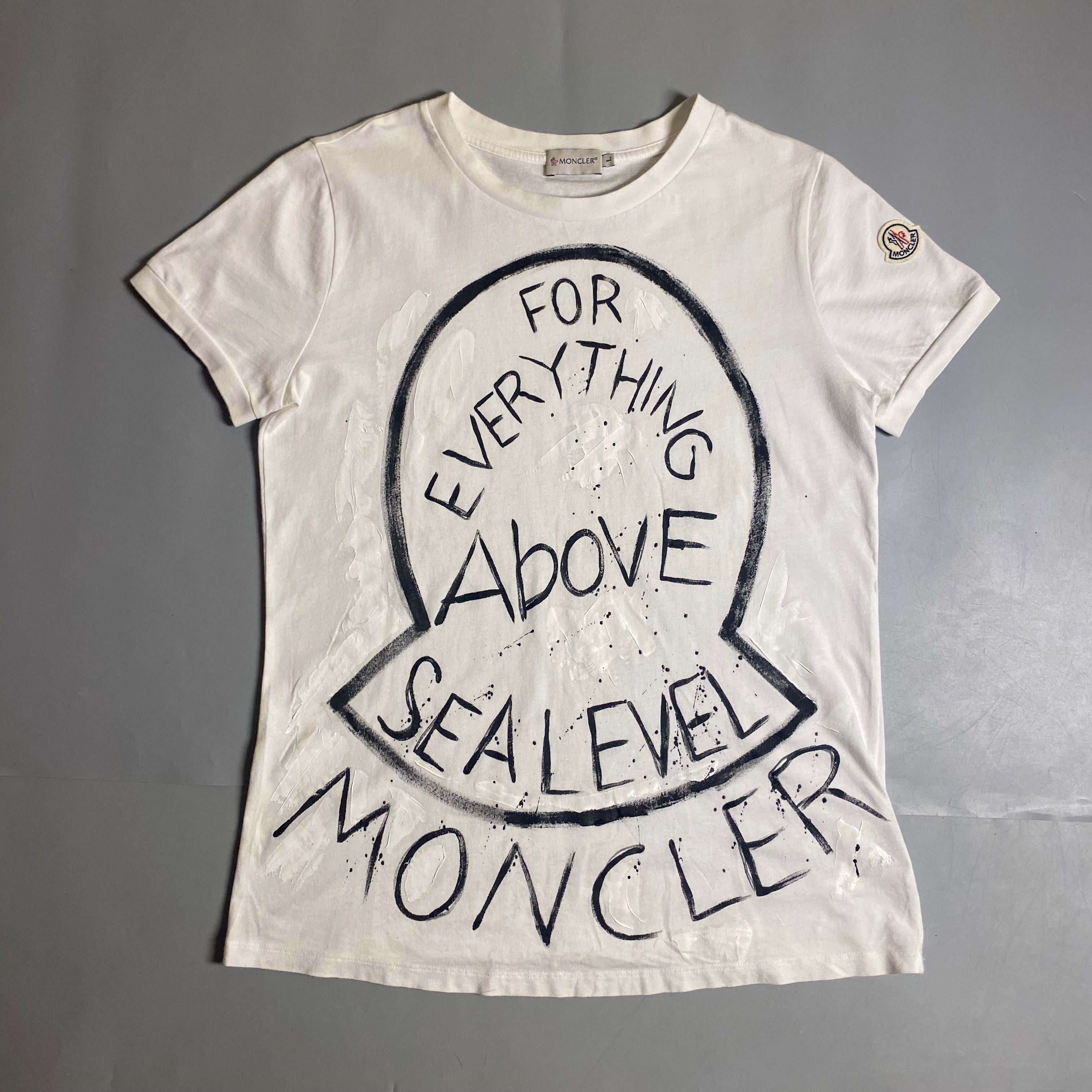 Moncler T-shirt featuring a hand-painted "For Everything Above Sea Level" graphic