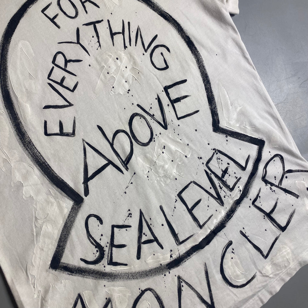 Moncler T-shirt featuring a hand-painted "For Everything Above Sea Level" graphic
