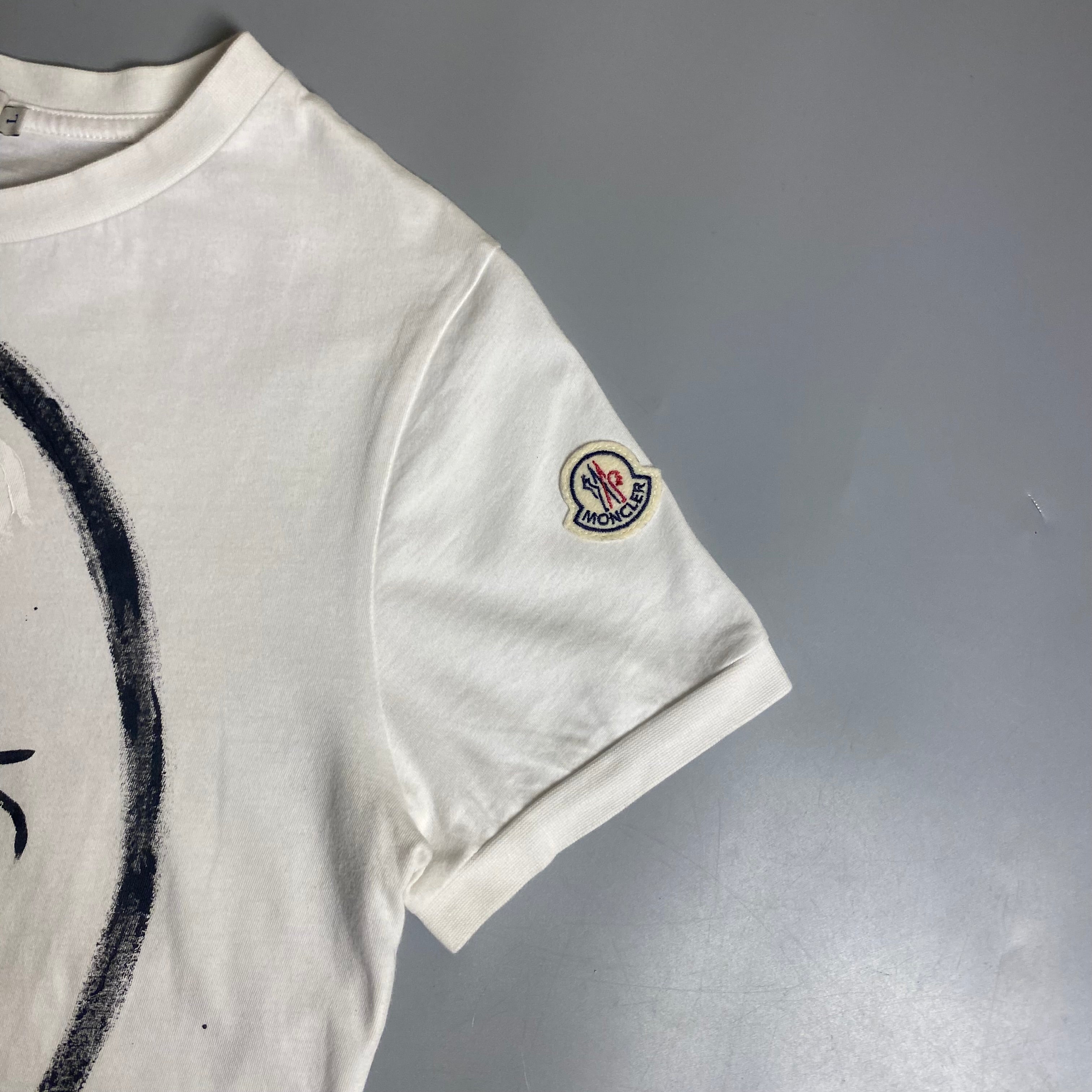 Moncler T-shirt featuring a hand-painted "For Everything Above Sea Level" graphic